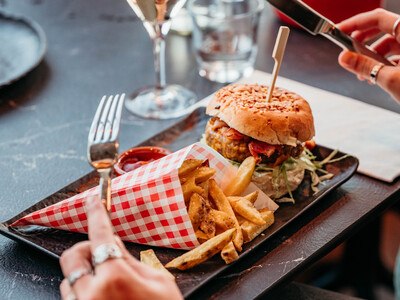 Served table with hamburger and fries at Restaurant Vlonders